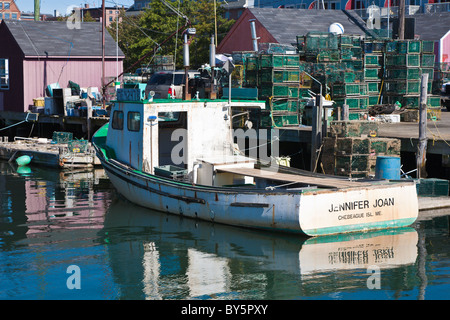 Commercial lobster fishing boats tied to pier in Portland, Maine Stock Photo