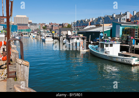 Commercial lobster fishing boats tied to pier in Portland, Maine Stock Photo