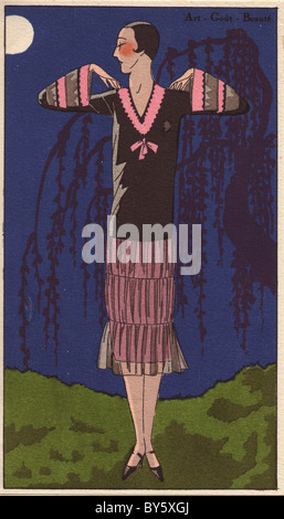 1920s women's fashion from AGB: afternoon dress in black taffeta and chiffon decorated with pink taffeta. Stock Photo