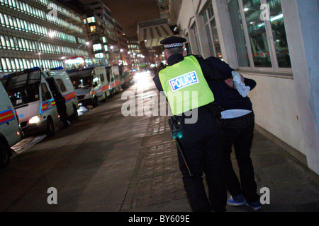 Police arrest a demonstrator during an EMA protest in Victoria Street Stock Photo