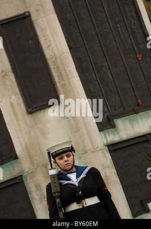 a female sea cadet stand guard at the Cenotaph during remembrance day , central park , east ham Stock Photo