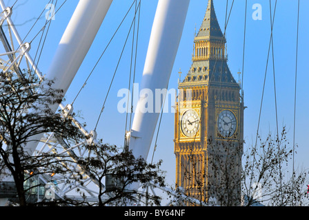 Big Ben with the structure of the London Eye in foreground Stock Photo