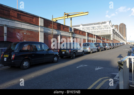 Long queue of London taxis at Waterloo Station, the effects of the current recession having serious consequences on the trade. Stock Photo