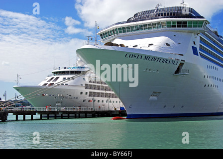 Bows of two cruise liners (Costa Mediterranea and Silver Cloud), St. John’s, Antigua, Leeward Islands, Caribbean. Stock Photo
