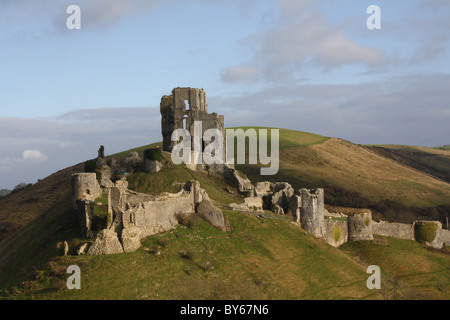 Corfe Castle in January with blue sky. Iconic hill castle destroyed by Oliver Cromwell in 1645. Gateway to Purbeck in Dorset Historical importance Stock Photo