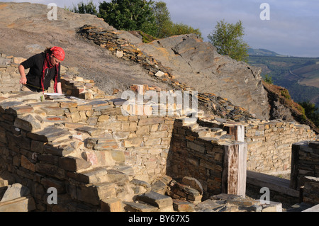 Archaeologist working of the  ' Domus ' ( 1 st  AD )   Archaeological site ' Chao Samartin ' Asturias SPAIN Stock Photo