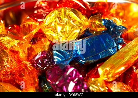tin selection of wrapped up quality street chocolate sweets in colourful wrappers Stock Photo