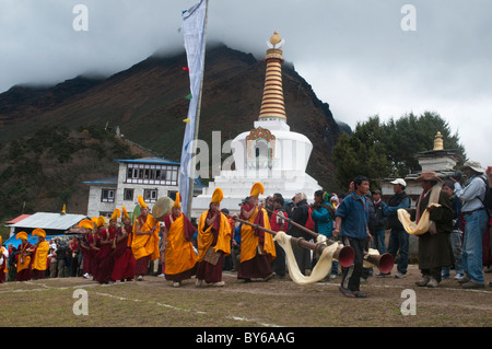 yellow hat Gelugpa monks at the Mani Rimdu Festival at Tengboche Monastery in the Everest Region of Nepal Stock Photo