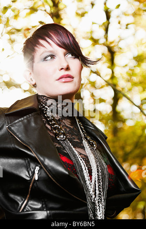 Shot of an Alternative Girl in Forest Stock Photo