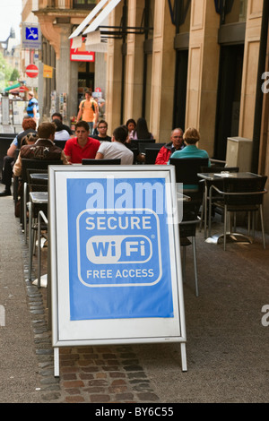 Luxembourg, Europe. Internet cafe with sign for secure free access wifi on the pavement outside Stock Photo