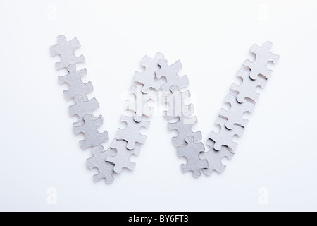 W letter made by puzzle pieces Stock Photo