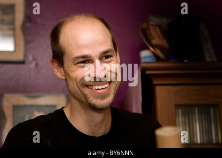 Young adult man laughs. Stock Photo