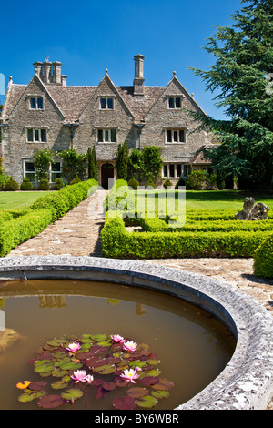 A grand English country manor house in summer