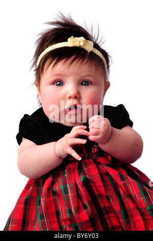 baby on white in checkered dress counting fingers Stock Photo