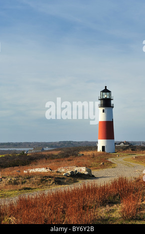 Sankaty Head Light Lighthouse on the island of Nantucket, Massachusetts, USA view across the moors in autumn with winding path. Stock Photo