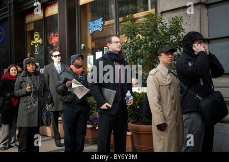 Job seekers line up for a job fair in midtown in New York Stock Photo