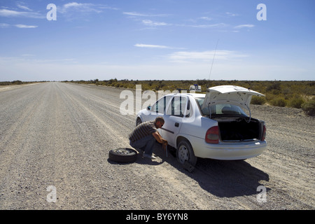 Taxi with flat tire on gravel road, Peninsula Valdes, Chubut, Patagonia, Argentina, South America, America Stock Photo
