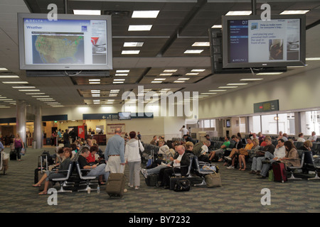 Fort Ft. Lauderdale Florida,FLL,Fort Lauderdale Hollywood International Airport,Delta Airlines,terminal,gate,departure,waiting area,seats,sit,passenge Stock Photo