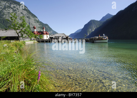 Boat mooring in front of the church of St. Bartholomae, St. Bartholomae, lake Koenigssee, Berchtesgaden national park, Berchtesg Stock Photo