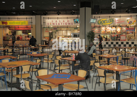 Atlanta Georgia,CNN Center,atrium,stores,fast food court plaza,Moe's Southwest Grill,Salad Sensations,sandwich shop,table,Black man men male,customer, Stock Photo