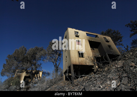 A house burned by a massive forest fire sits in a slope in Kibbutz Beit Oren located in the heart of Carmel mountain range in northern Israel Stock Photo