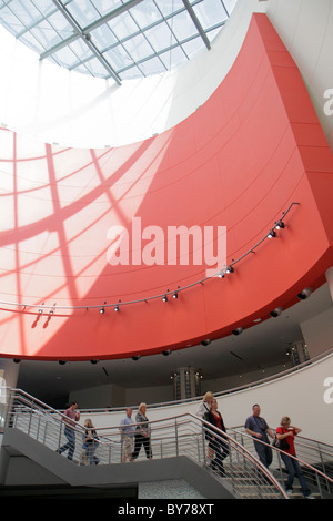 Atlanta Georgia,Pemberton Place,Georgia Aquarium,atrium,stairs,man men male,woman female women,descend,red wall,skylight,GA101008072 Stock Photo