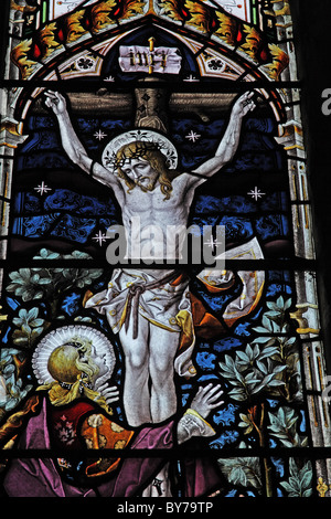 A stained glass window depicting The Crucifixion, Parish Church of St Laurence, Napton, Warwickshire Stock Photo