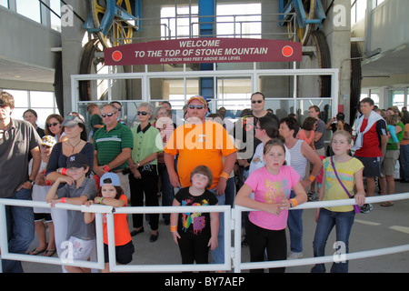 Atlanta Georgia,Stone Mountain Park,quartz monzonite,monadnock,geology,summit,Skyride,Swiss cable car,gondola lift,line,waiting,passenger passengers r Stock Photo