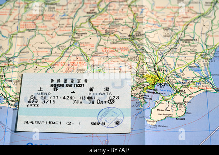 japanese reserved seat ticket and tourist map of japan showing tokyo Stock Photo