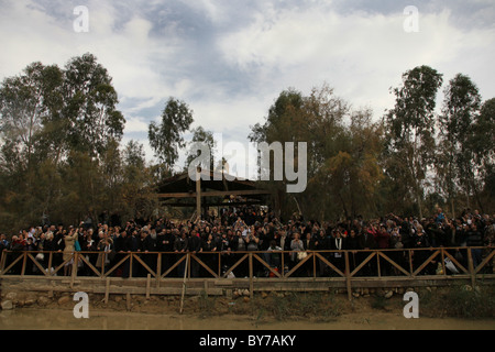 Christian pilgrims taking part in the Epiphany ceremony in the baptismal site Al-Maghtas officially known as Bethany considered to be the traditional site of the baptism of Jesus by John the Baptist located on the eastern bank of the Jordan River in Jordan Stock Photo