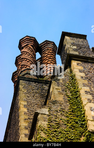 Tall ornamental brick chimneys on old English mansion Stock Photo