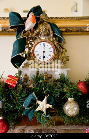 19th century French mantle clock with Christmas decorations Stock Photo