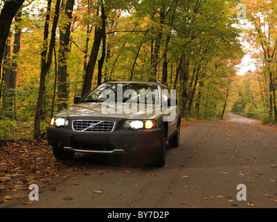 License available at MaximImages.com - Volvo XC70 car on a country road in fall nature scenery. Algonquin, Ontario, Canada. Stock Photo