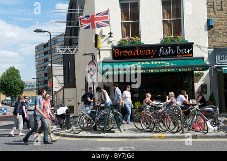 Bicycles outside Fish and chip shop in Broadway Market London Stock Photo