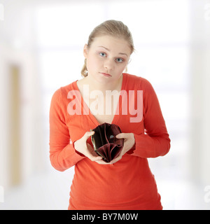 Young woman shows her empty wallet Stock Photo