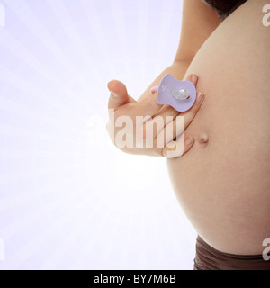 Pregnant woman holding dummy Stock Photo