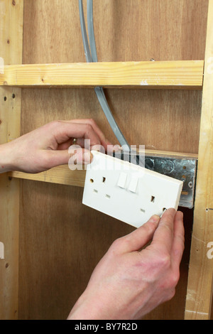 Wiring electrical power socket UK showing wire connections. Image on