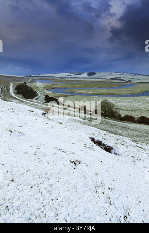 Snow clouds gather over the Cuckmere Valley, Exceat Nr Eastbourne, East Sussex, England. Stock Photo