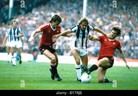 West Bromwich Albion V Manchester United Gary Owen of WBA between Mike Duxbury and Brian Robson 1980s Stock Photo