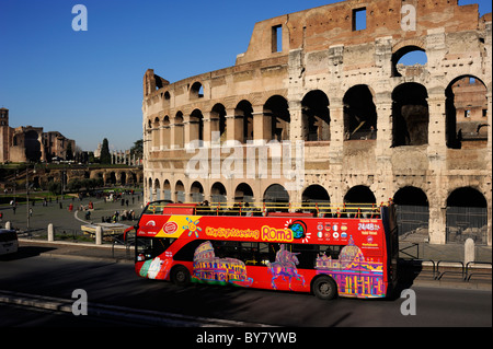 italy, rome, tourist bus and colosseum