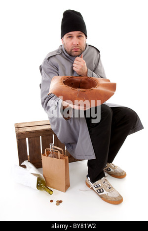 social issue; homeless beggar holding hat for money over white background Stock Photo