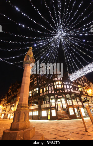 City of Chester, England. Christmas view of the Chester High Cross at the Eastgate and Bridge Street junction. Stock Photo