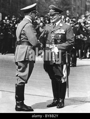 Adolf Hitler in uniform wearing a self awarded Iron Cross medal making ...