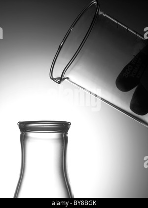 Glass Beakers In Lab With Hand Stock Photo