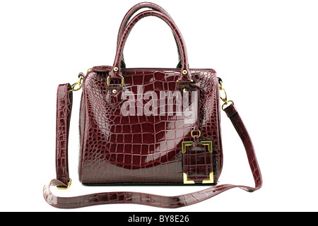 maroon imitation crocodile leather handbag Stock Photo