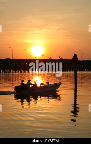 Fishing boat at sunrise on Boca Ceiga Bay in Madeira Beach Florida Stock Photo