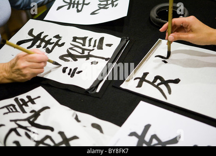 Students in a calligraphy class.  Stock Photo