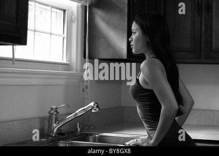 A pretty Filipino American woman with long brown hair