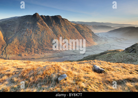 Winter sunlight on the Langdale Pikes and frosty Great Langdale Valley in the English Lake District. Taken from Bowfell Stock Photo