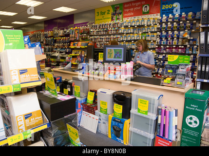 England West Sussex Chichester Ryman's office stationery store interior with two female shop assistants behind counter. Stock Photo